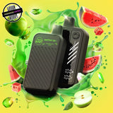 A 20ml disposable vape by Flavour Beast in watermelon apple flavour, surrounded by watermelon slices, apples, and a green splash of liquid. Underground Vapes Woodstock and London