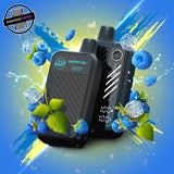 A 20ml disposable vape by Flavour Beast in sour blue razz iced flavour, surrounded by blue raspberries and ice cubes. Underground Vapes Woodstock and London