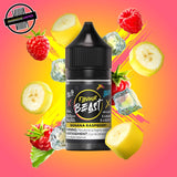A 30ml bottle of Flavour Beast E-liquid in banana raspberry ice flavour, surrounded by red raspberries, banana slices and ice cubes, on a bright pink and yellow background. Underground Vapes Woodstock and London