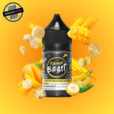 A 30ml bottle of Flavour Beast E-liquid in banana mango ice flavour, surrounded by banana slices, mango slices, and ice cubes, on a bright yellow background. Underground Vapes Woodstock and London