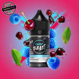 A 30ml bottle of Flavour Beast E-liquid in blue raspberry cherry flavour, surrounded by blue raspberries and cherries, on a bright pink and blue background. Underground Vapes Woodstock and London