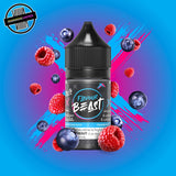A 30ml bottle of Flavour Beast E-liquid in blue razz flavour, surrounded by blueberries and raspberries, on a bright blue and pink background. Underground Vapes Woodstock and London
