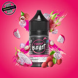 A 30ml bottle of Flavour Beast E-liquid in dragonfruit lychee ice flavour, surrounded by lychees and dragonfruit slices and ice cubes, on a bright pink background. Underground Vapes Woodstock and London