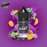 A 30ml bottle of Flavour Beast E-liquid in grape passionfruit ice flavour, surrounded by purple grapes, passionfruit slices, and ice cubes, on a bright purple background. Underground Vapes Woodstock and London