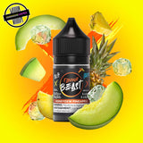 A 30ml bottle of Flavour Beast E-liquid in honeydew pineapple ice flavour, surrounded by pineapple, melon slices, and ice cubes, on a bright yellow-orange background. Underground Vapes Woodstock and London