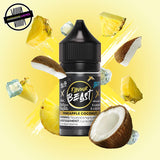 A 30ml bottle of Flavour Beast E-liquid in pineapple coconut ice flavour, surrounded by pineapple and coconut slices, and ice cubes, on a light yellow background. Underground Vapes Woodstock and London