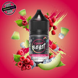A 30ml bottle of Flavour Beast E-liquid in raspberry honeydew ice flavour, surrounded by honeydew slices , raspberries, and ice cubes, on a bright pink and green background. Underground Vapes Woodstock and London