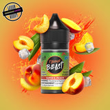 A 30ml bottle of Flavour Beast E-liquid in tangy peach ice flavour, surrounded by peach slices and ice cubes, on a bright orange background. Underground Vapes Woodstock and London