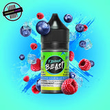 A 30ml bottle of Flavour Beast E-liquid in sour blue razz ice flavour, surrounded by blueberries, raspberries, and ice cubes, on a bright blue background. Underground Vapes Woodstock and London