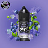 A 30ml bottle of Flavour Beast E-liquid in sour blueberry ice flavour, surrounded by blueberries and ice cubes, on a bright purple background. Underground Vapes Woodstock and London