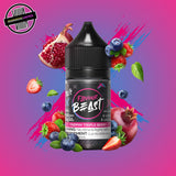A 30ml bottle of Flavour Beast E-liquid in triple berry flavour, surrounded by pomegranate, blueberries, and strawberries, on a bright purple-blue background. Underground Vapes Woodstock and London