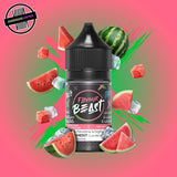 A 30ml bottle of Flavour Beast E-liquid in watermelon ice flavour, surrounded by watermelon slices and ice cubes, on a bright pink and green background. Underground Vapes Woodstock and London