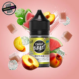 A 30ml bottle of Flavour Beast E-liquid in Sweet G.B. ice flavour, surrounded by watermelon and peach slices, sugar cubes, and ice cubes, on a pastel peach background. Underground Vapes Woodstock and London