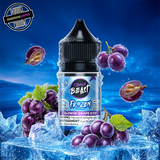 A 30ml bottle of Flavour Beast E-liquid Frozen Series in grape iced flavour, sitting on a pile of ice and surrounded by purple grapes, on a bright blue background. Underground Vapes Woodstock and London