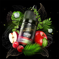 A 30ml bottle of Flavour Beast x Twelve Monkeys vape juice surrounded by red apples, cranberries, ice cubes and green leaves. Available at Underground Vapes Woodstock and London.