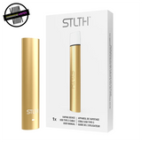 Metallic Gold STLTH USB Type-C stick-style device / battery next to its packaging. Underground Vapes Woodstock and London