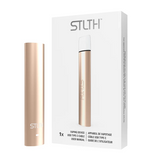 Metallic Rose Gold STLTH USB Type-C stick-style device / battery next to its packaging. Underground Vapes Woodstock and London